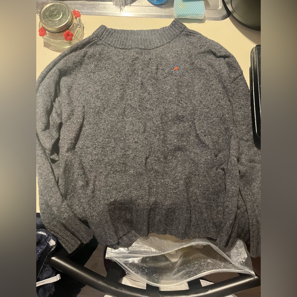 Grey sweater with embroidered flower